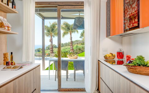 Villa Smeraldo - Sea Front | By Rocco Forte Villas: Ejendom, Plante, Countertop, Cabinetry, Azure, Bygning, Bord, Belysning, Orange, Indretning