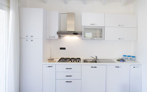 Villa Asparago: Køkken, Større Bandage, Køkken Apparat, Countertop, Cabinetry, Indretning, Komfur, Husholdningsapparat, Køkkenvask, Gulvbelægning